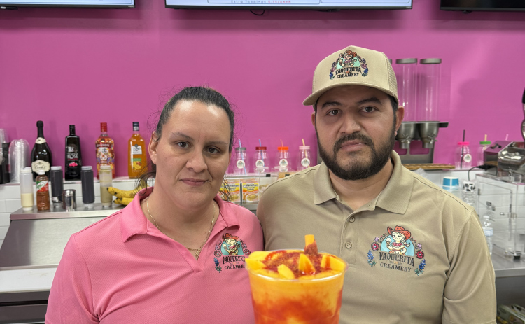 Owners of La Vaquerita Creamery, Yozoe Delatorre and Modesto Arismendi, show off a Mangonada— their best seller.