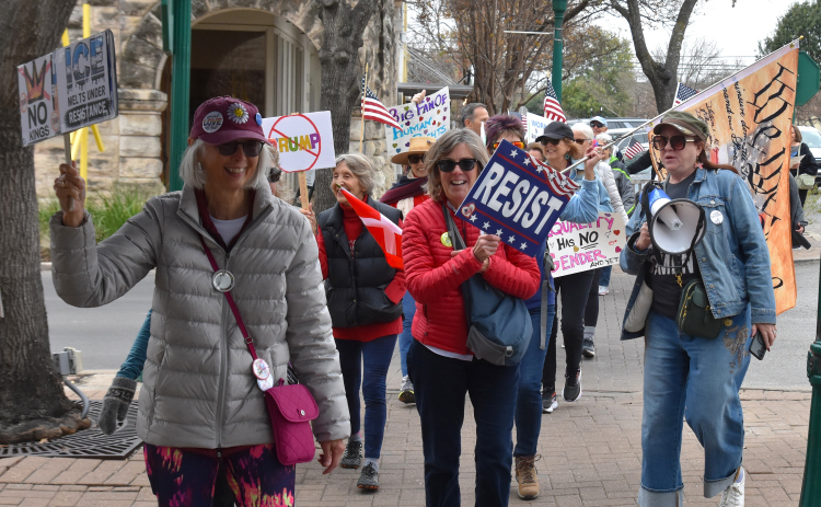 During the national Walk out for Freedom on Tuesday, January 20, Williamson County residents took part by protesting Immigration Customs Enforcement, President Donald Trump and his recent talk of making Greenland the next U.S. state. Protestors walked around the Williamson County Courthouse and the Square in downtown Georgetown. (Photo by Kaitlyn Wilkes)