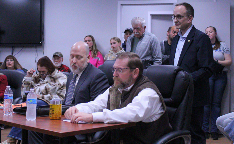 Former Police Lieutenant David Guthrie, right, and his lawyer Robert McCabe, left, appeal Mr. Guthrie’s at-will termination on January 20 during the February 10 Special Called Florence City Council meeting. Photo by Nalani Nuylan.