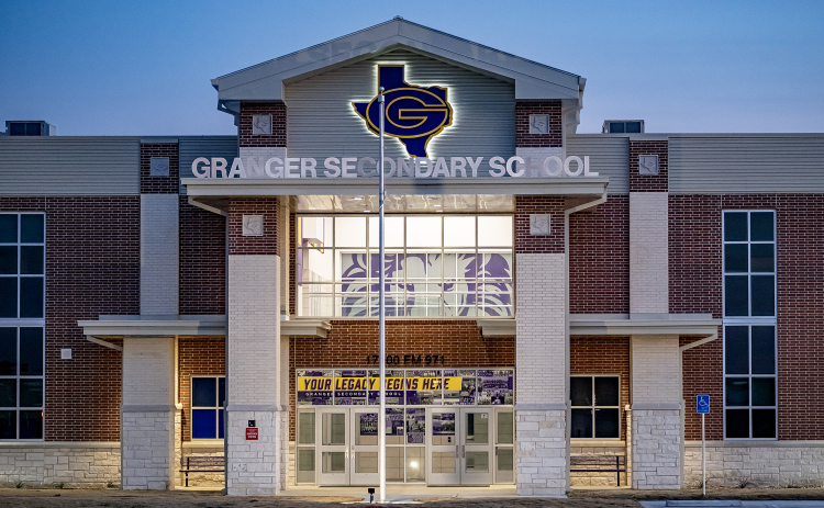 Granger Secondary School, along FM 971 east of downtown Granger, is pictured on Sunday, February 22, 2026. The face of a lion, the school mascot, can be seen inside.  from a distance.  After a long delay to work on water issues the school will open for classes on March 2, 2026.    Photo by Andy Sharp.