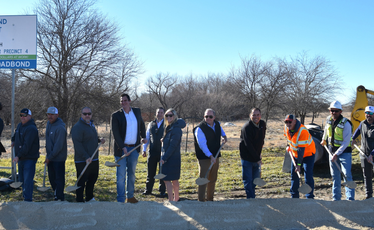 From left: Liviu Reynolds, FLAG; Todd Glanville, City of Georgetown; Daniel Hernandez, City of Georgetown; Lua Saluone, City of Georgetown; Dave Jones, RPS; Kate Wilder, HNTB; Commissioner Russ Boles, Precinct 4; Oscar Salazar-Bueno, HNTB; John Russell, HNTB; Andrew Batten, Joe Bland Construction; Will Byerly, Joe Bland Construction; and Steven Shull, HNTB at the groundbreaking for County Road 110 North. (Photo by Kaitlyn Wilkes)