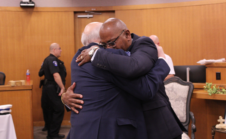 Stephen “Steve” Miller (right) hugs long-time friend, former Judge  Billy Ray Stubblefield (left) during Mr. Miller’s retirement celebration after 30 years of service on February 27 at the 26th District Court in Williamson County. Judge Stubblefield later described Mr. Miller as a brother in his farewell speech.