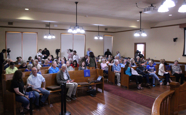 About 100 residents pack the Commissioners Court room Teusday afternoon to find answers and air grievances regarding the Primary Election. Photo by Nalani Nuylan.