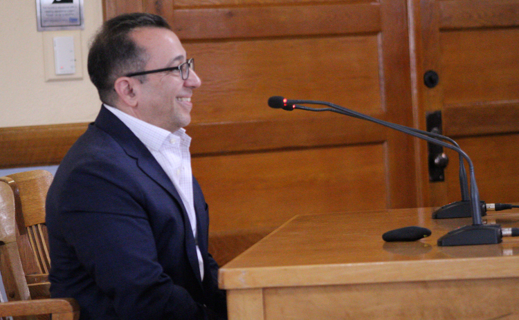 Rick Ortiz, people operations team head at Compal USA Technology Inc., thanks the Commissioners Court for approving the tax abatement on April 14. Photo by Nalani Nuylan.