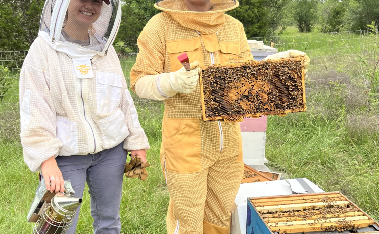 Southwestern students Layla Hoffen and James Cosman are with the club BEE-Co. short for Beekeeping Education and Engagement Community.  Layla Hoffen founded the group. Photo by Linda Dwyer
