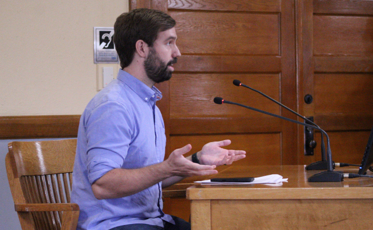 James Headrick, organizer for NotByOurSchools, which is a group of Georgetown residents who want the new Jail and Justice Center to be on a different property, speaks on why the current 248-acre site is not a good idea. Photo by Nalani Nuylan.