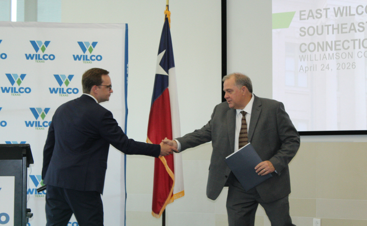 Precinct 4 County Commissioner Russ Boles (right) welcomes Ronald Kurtz, U.S. Department of Housing and Urban Development (HUD) Assistant Secretary for Community Planning and Development, to Wilco, April 24. Photo by Nalani Nuylan.
