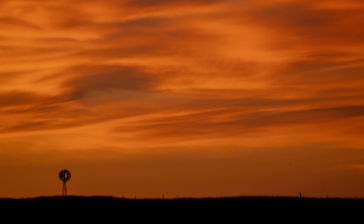 The skies fill with vibrant color a few minutes past sunset  in this view from County Road 420 in Thrall on Wednesday, May 27, 2026.  Photo by Andy Sharp.