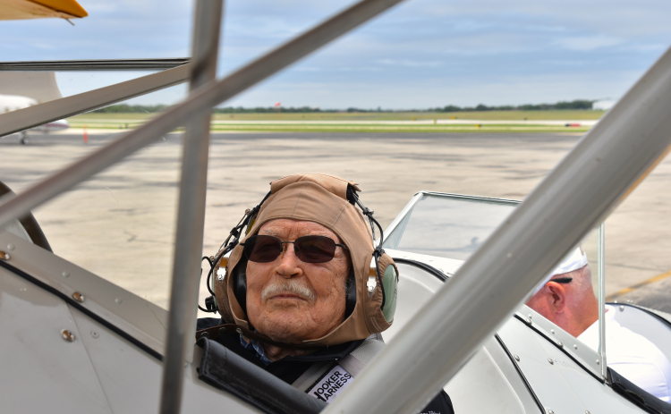 Grover Trytten, a 104-year-old WWII veteran who flew nighttime missions including Battle of the Bulge, smiles before takeoff during Dream Flights on May 6.