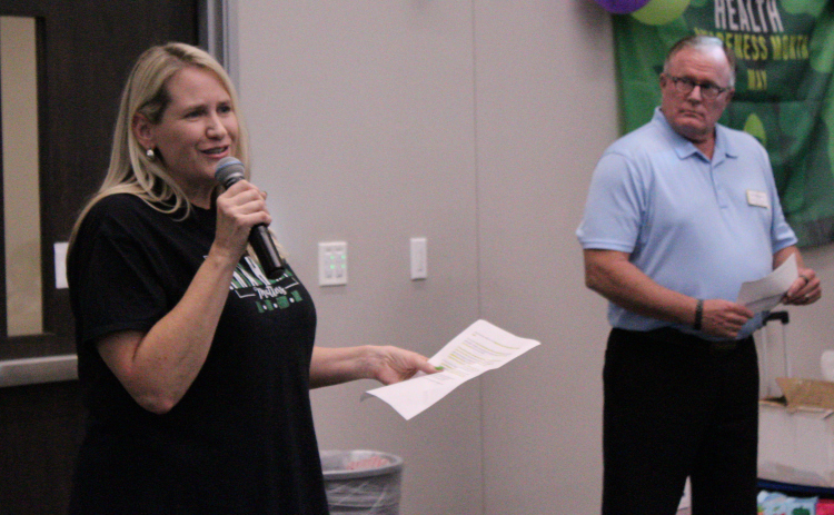 Evelyn McLean, Justice of the Peace for Precinct 3 in Williamson County (left), welcomes everyone in attendance to the 6th annual Mental Health and Wellness Expo, May 27 at the Georgetown Annex. Photo by Nalani Nuylan.