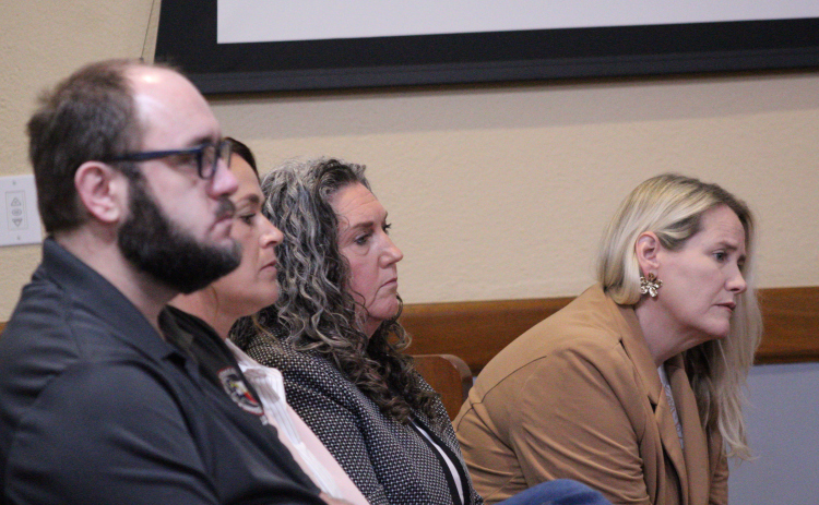 The Williamson County Justices of the Peace attend the June 9 Commissioners Court to advocate entering into a contract with Tranquil Mortuary. Photo by Nalani Nuylan.