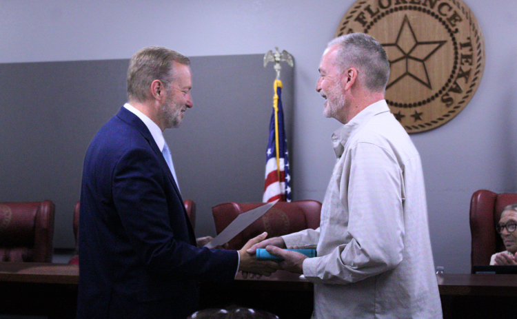 Ben Daniel, right, is sworn in by County Judge Steve Snell, left, as the Mayor for the City of Florence for his second and final term during the June 2 City Council meeting. Photo by Nalani Nuylan.
