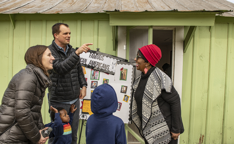 Reverend Bobby Hulme-Lippert, pastor at Georgetown's First Presbyterian Church, was accompanied by his wife Michelle and their children Logan, 2, and Leo, 7, as they visited with Paulette Taylor, right, at  the Shotgun House Museum on Saturday, February 18, 2023.   Located at 801 West Street, the is  museum is maintained by the Georgetown Cultural Citizen Memorial Association.  Photo by Andy Sharp