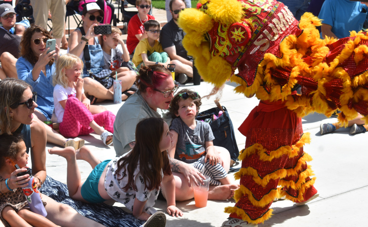 The dragon engages audience members. Photo by Katherine Hamilton