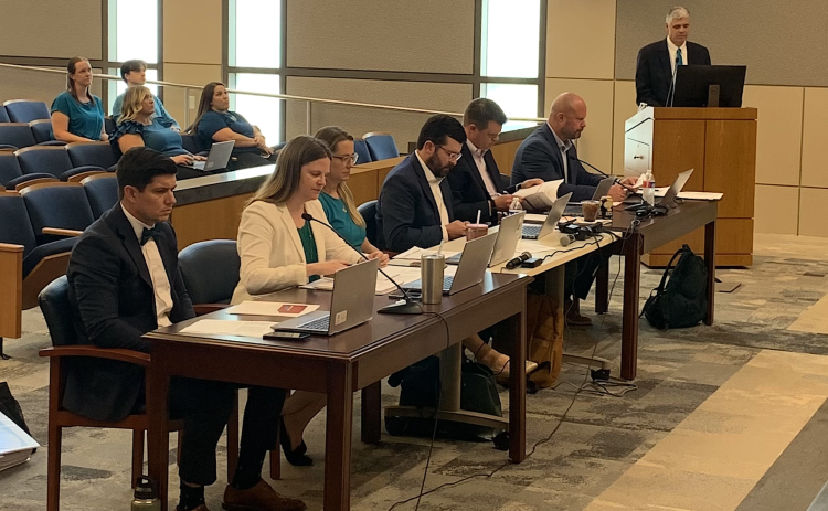 City Manager David Morgan, back at the podium, presents the preliminary Fiscal Year 2027 budget to Georgetown City Council on June 23. Members of Georgetown’s finance department sit in the front row. (Photo by Kaitlyn Wilkes)