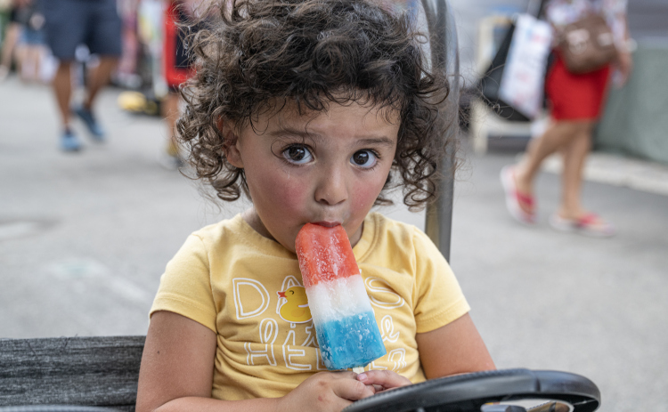 2-year-old Elliott Malz enjoys an icy treat on a warm morning during Market Days on Saturday, July 11, 2026.  Market Days  is held on the second Saturday  of the month in downtown Georgetown.   Photo by Andy Sharp
