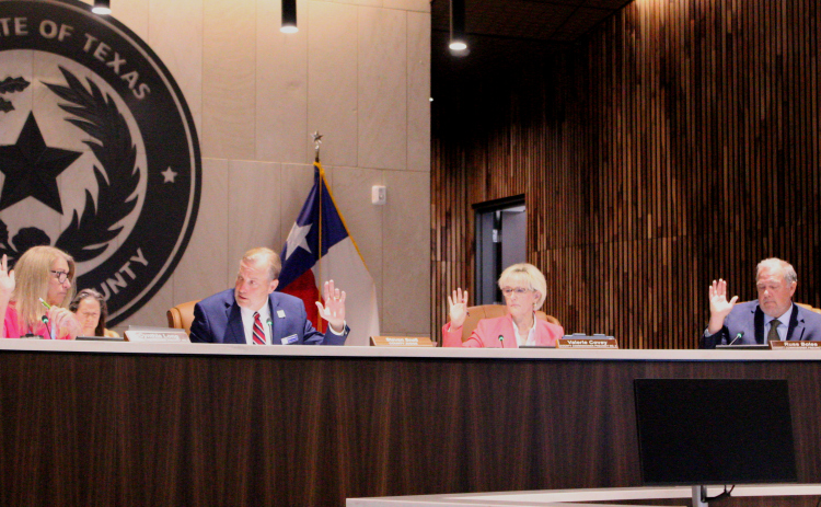 The Williamson County Commissioners approved supporting four Williamson County nonprofits by giving $200,000 each during the July 14 meeting. From left are Commissioner Cynthia Long, County Judge Steve Snell, Commissioner Valerie Covey and Commissioner Russ Boles. Photo by Nalani Nuylan.