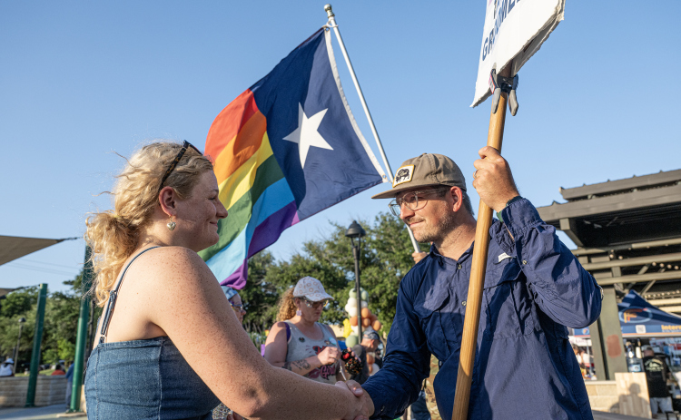 Caleb Ripple, right, joined others from Taylor’s Christ Fellowship Church who have expressed an opposition to the  6th Annual Taylor Pride Festival, held at Heritage Square Park on Saturday evening, June 27, 2026.     Photo by Andy Sharp