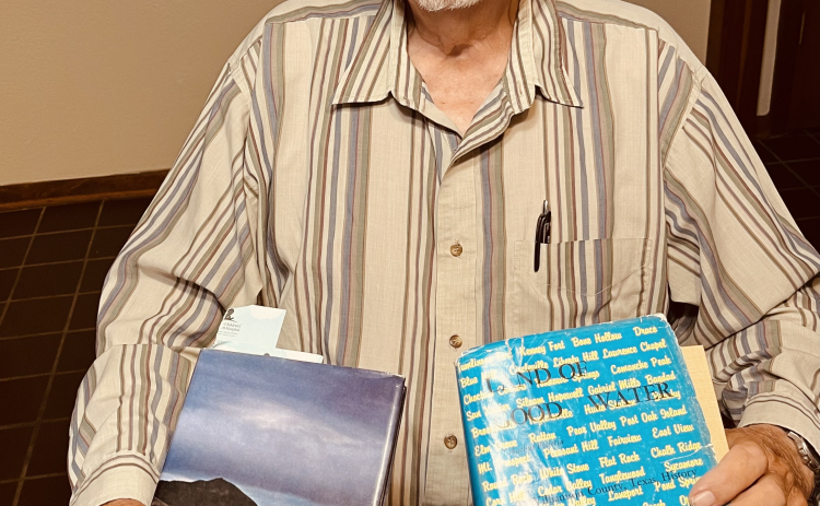 Georgetown resident Edward Pastor displays history books he used to learn about John Sparks, a former Nevada governor who lived in Georgetown in the late 1800s.  Photo by Linda Dwyer