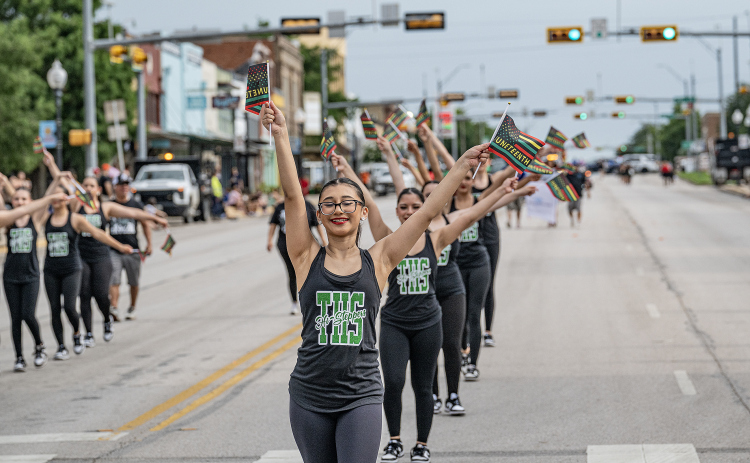 Members of the Taylor ISD Hi-Steppers Dance Troupe  march along Main Street as they participate in Taylor’s Juneteenth celebration on Saturday, June 20, 2026.    Photo by Andy Sharp