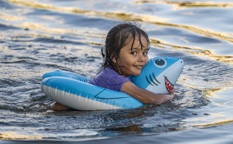 4-year-old Alison Santes enjoyed the cool waters of the San Gabriel River near San Gabriel Park on Monday, June 22, 2026, the first day of summer.  Temperatures reached into the mid-upper 90s on this day.    Photo by Andy Sharp