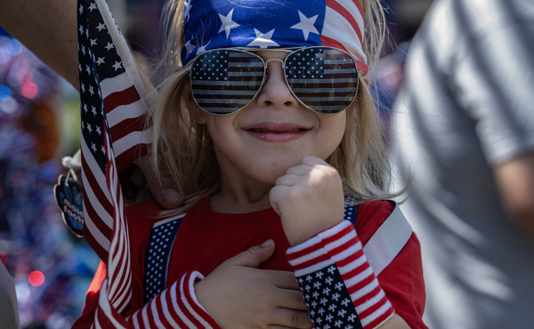 4-year-old Waylon Goebel, saluting during the posting of the colors, was one of the colorfully attired participants in the Sertoma Club’s Hometown Parade through San Gabriel Park during the Sertoma Club 4th of July celebration on Saturday, July 4, 2026.   Photo by Andy Sharp