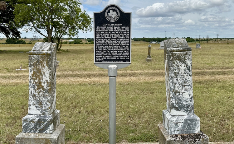 A historic marker in Corn Hill Cemetery tells the story of Daniel Harrison.   Photo by Joe Plunkett