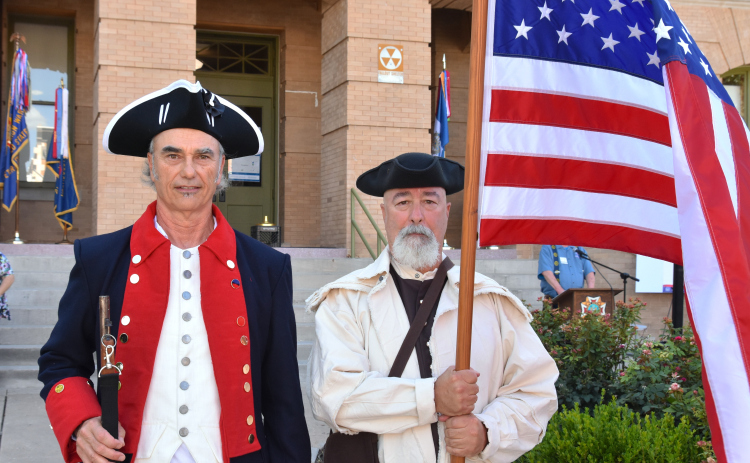Mark Chester, left, and Keith Pearce, from the Sons of the American Revolution Alexander Hamilton Georgetown Chapter, were dressed in 18th century period clothing on July 8. They presented the colors before a reading of the Declaration of Independence on the Square. (Photos by Kaitlyn Wilkes)