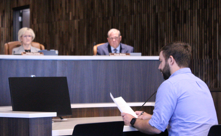 Carlson Place resident James Headrick, front, expresses his opposition to the Justice Complex property to the Williamson County Commissioners Court, August 4. Photo by Nalani Nuylan.