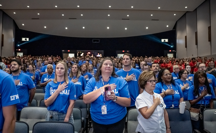 Georgetown ISD teachers and staff members stand for the Presentation of the Colors during  the Georgetown ISD Convocation on Monday, August 10, 2026.  Trustees say the tax rate election is necessary because there are no funds available in this year’s budget for employee pay raises. Photo by Andy Sharp