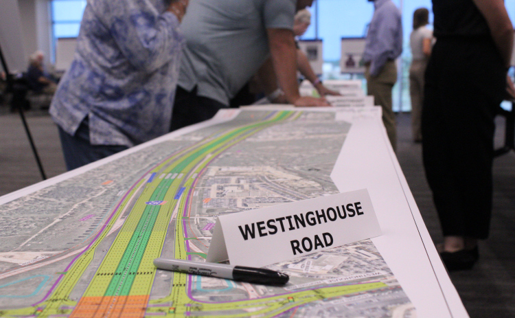 Residents analyze and ask questions about the proposed Interstate Highway 35 schematics during a Texas Department of Transportation open house in the evening at the Georgetown Annex, Thursday, August 13. Photo by Nalani Nuylan.
