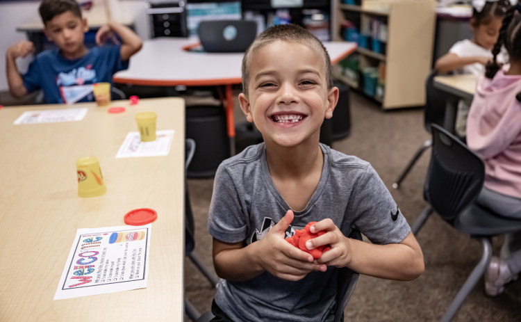 6-year-old Camden Velez happily settles into his kindergarten classroom on Wednesday, August 19, 2026,  the first day of classes at George Washington Carver Elementary School.