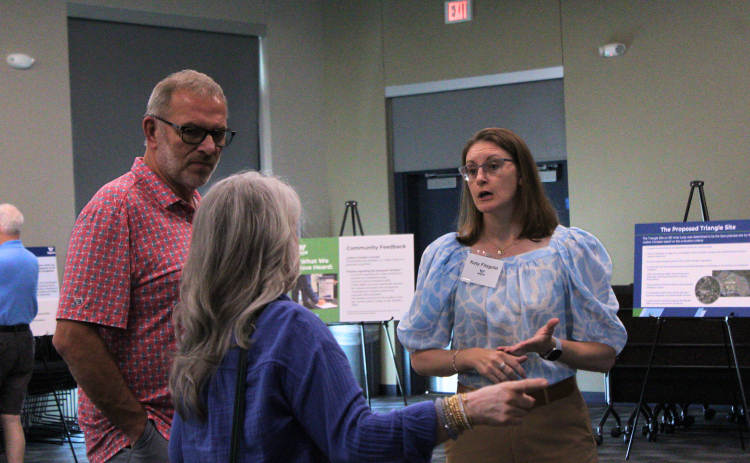 Ed and Silvia Stade, left, speak with Kathy Fitzgold, who is part of the Jail and Justice Center Complex project team, during a community engagement meeting Saturday, August 22, at the Williamson County EMS North Campus. Photo by Nalani Nuylan.