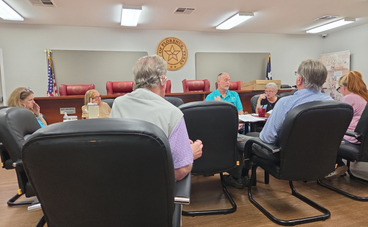 Florence Mayor Ben Daniel, center, listens to developer Robert Peerman, front left, provide a status update on the Nightingale subdivision during a special City Council workshop on July 27. Photo by Nalani Nuylan.
