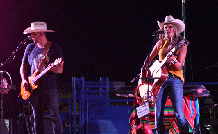 Texas Country Artist of the Decade Bri Bagwell, right, and her band mate headline a charity concert for the Jarrell Community Library and Resource Center at the Williamson County Sheriff's Posse Rodeo Area, July 25. Photo by Nalani Nuylan.