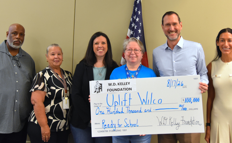 From left, Keith Parker, JISD Communities in Schools site coordinator; Evelyn DeJesus, JISD social worker; Jane Medema, Purl Elementary School counselor; Gloria Casso, Family Support Specialist at Mary Bailey Head Start; Carl Illig, executive director of the W.D. Kelley Foundation; and Shannon Illig, operations manager of the W.D. Kelley Foundation, at the check presentation on August 17. (Photos by Kaitlyn Wilkes)