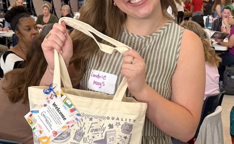 Landrie Mays, first-year teacher at Purl Elementary School, smiles with her welcome bag that was given to 315 new teachers throughout Georgetown. (Courtesy Georgetown Chamber of Commerce)