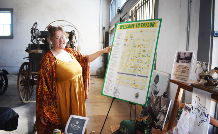 Ruby Fisher, Taylor’s Special Events Coordinator, welcomes visitors to the Sesquicentennial activity — Spark! — a museum exhibit that tells the story of the small town on Texas’ Blackland Prairie. The exhibit is open through September 26. Photo credit Katherine Hamilton