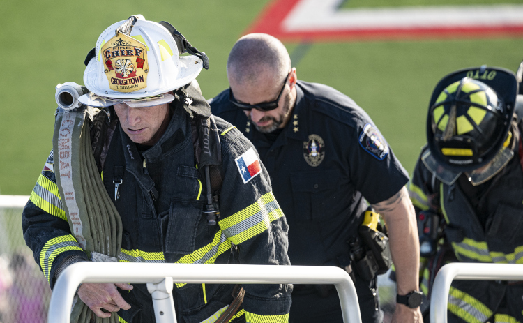 Georgetown Fire Department Chief John Sullivan, front, and Georgetown Police Department Chief Cory Tchida participate in the 2025 stair climb at the Georgetown High School football field. (Georgetown Fire Department)