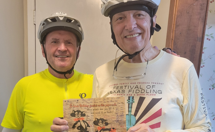 Louis Rumsey, left, and Les Sherman, who have been friends for 71 years, hold the birthday card they’ve been passing back and forth since 1968. Les lives in Georgetown and Louis lives in the Dallas area. (Photo courtesy of Les Sherman)