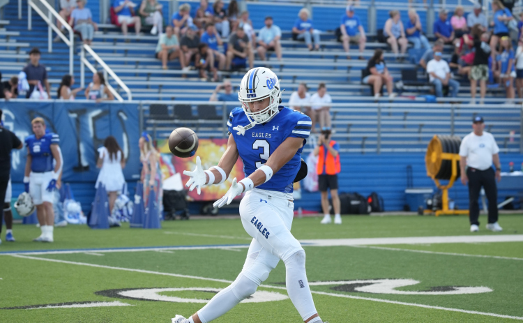 Cade Erickson reaches for a downfield catch before a big gain.  Photos by Lawson Richter