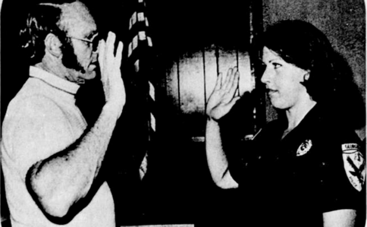 September 9, 1976: Linda Rumbaugh of Salado is sworn in as Georgetown's first female police officer by Asst. City Manager W. L. Walden. A dispatcher for the Georgetown police department the past four years, 24-year-old Rumbaugh got her badge in a City Hall ceremony last week and began patrol duties immediately. She completed officer training with three other women last month at Southwest Texas State University in San Marcos.