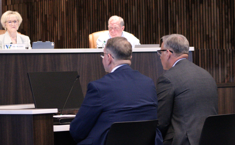 Commander John Foster, front right, and Detective David Boatright, front left, from the Williamson County Sheriff's Office explain how the Cold Case internship will benefit Williamson County during the October 21 Commissioners Court meeting. Photo by Nalani Nuylan.