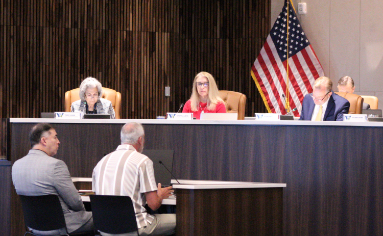 Scott Matthew, executive director of Williams County Juvenile Services, front right, and August Alvarado, director of District Court Administration, explain the Transformative Justice program to the Williamson County Commissioners, October 20. Photo by Nalani Nuylan.