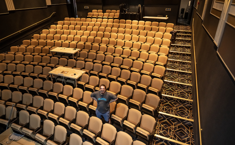 Morgan Taylor Myers, Director of Production at the Georgetown Palace, is surrounded by the new seating area at the historic theater on Tuesday, September 29. A late-January ice storm and flood decimated the seating area. After a few months the Springer Stage reopened, but with the old seats. The new seats await attendees for the Palace’s production of Oklahoma, which opens Friday, October 2, continuing through November 1.