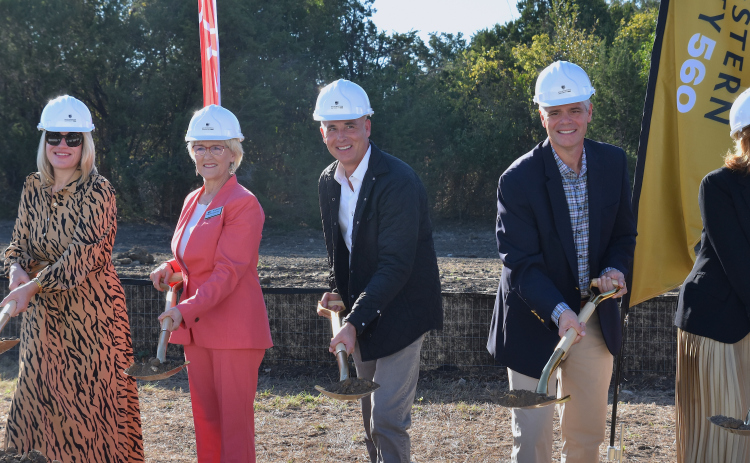 From left, Georgetown City Council Member Amanda Parr (who works at Southwestern), County Commissioner Valerie Covey, Mayor Josh Schroeder, City Manager David Morgan and Southwestern University President Laura Skandera Trombley break ground on the SU 560 development on October 23. (Photo by Kaitlyn Wilkes)