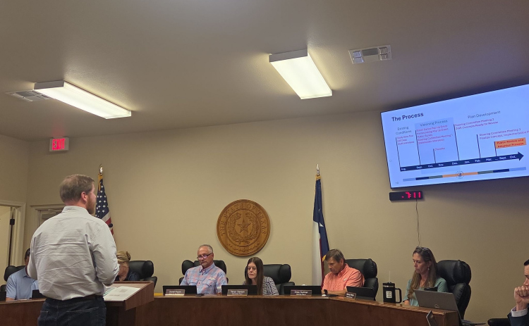 Ethan Harwell, an engineer with Kimley-Horn, presents the final draft of Jarrell’s Downtown Masterplan to city council on October 6. Photo by Nalani Nuylan