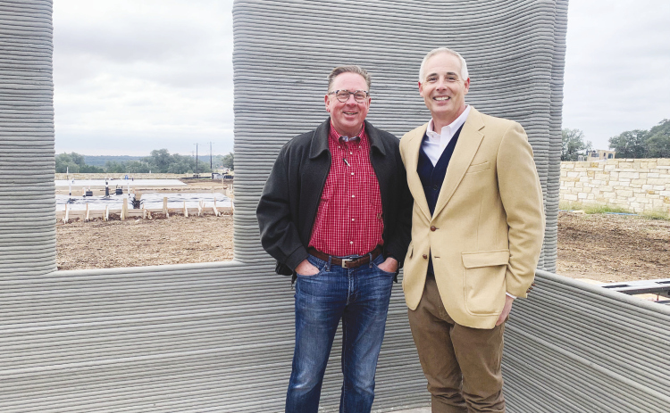 Georgetown Mayor Josh Schroeder, right, and District 2 Council Member Shawn Hood toured unfinished 3D printed houses, the product of homebuilder Lennar and manufacturers ICON, Tuesday, November 15. The homes are part of a 100-house section of the Wolf Ranch master planned community. PHOTOS BY BRIGID COOLEY