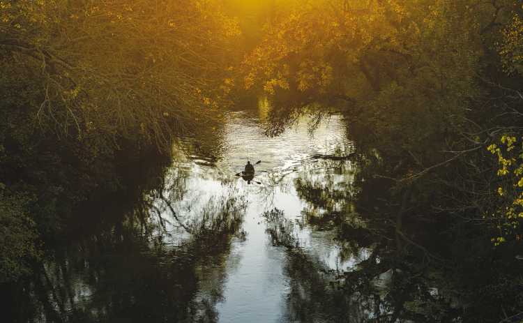 Cody Seigmund, navigating a well-equipped kayak, enjoyed an early evening of bass fishing along the scenic San Gabriel River on Tuesday, November 29. (Photo by Andy Sharp)